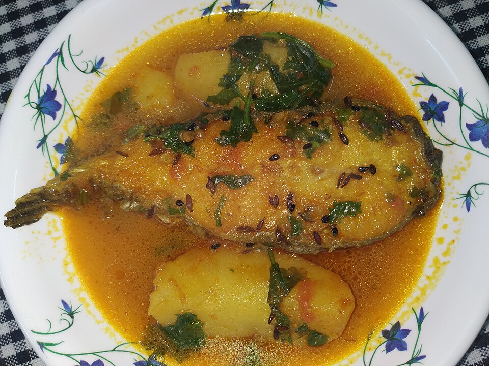 Alu dhonepata diye Boyal machher jhol - Traditional India dish